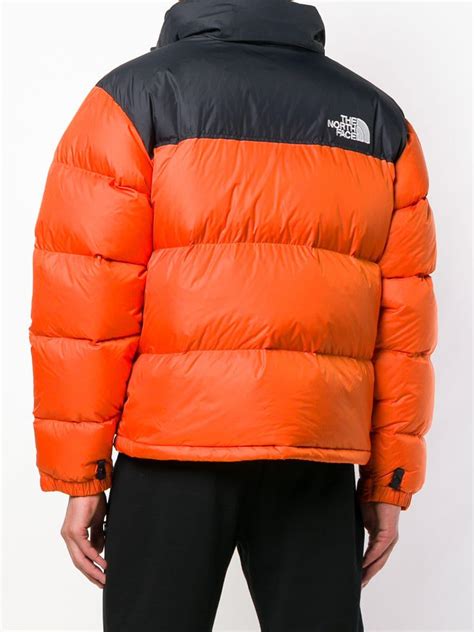 north face orange puffer jacket.